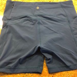 Blue Lululemon bike shorts with zippered pocket